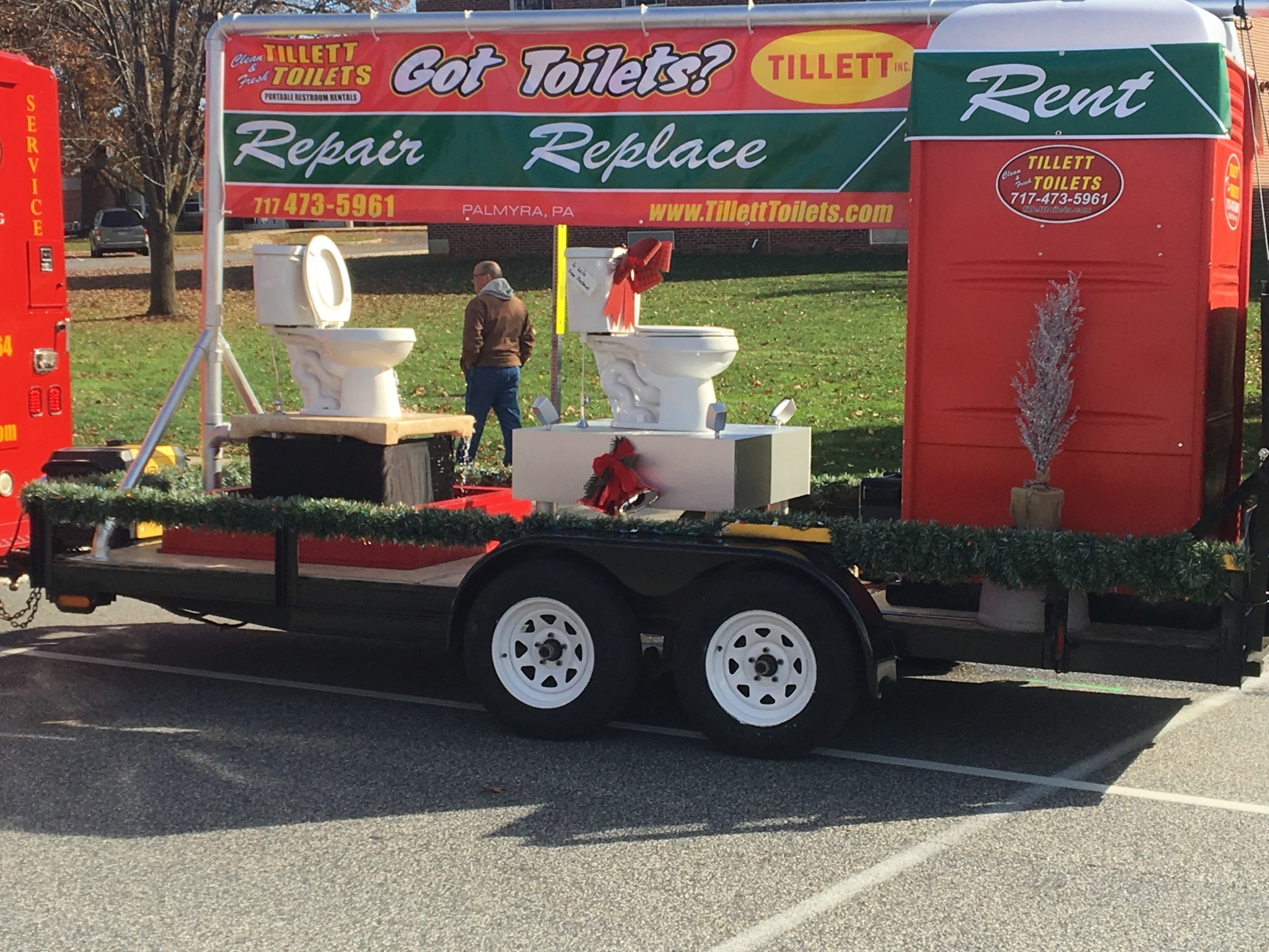 Another component of Tillett Toilets' parade participation is a float advertising services.